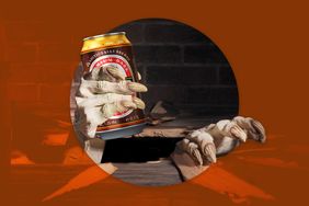 A skeletal hand holding a can with a rustic background