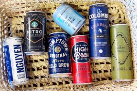 A selection of canned cold brew coffee arranged in a basket featuring brands like Starbucks Nguyen Stumptown High Brew and La Colombe