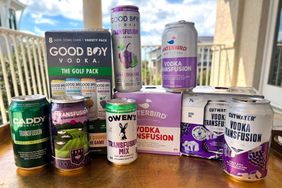 An assortment of canned vodka transfusion cocktails from different brands displayed on a table