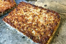 Closeup of a cooked slab of Cincinnatistyle Goetta on a griddle