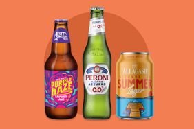Three bottles and cans of beer Abita Purple Haze Peroni 00 and Allagash Summer Lager displayed side by side