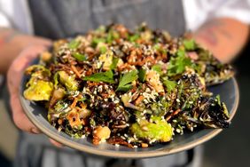 Cafe Olli's charred kalettes, chickpeas, pickled red onion, fried shallot, puffed rice, sesame, parsley, tahini caesar dressing