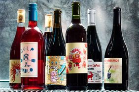 A selection of wine bottles displayed against a textured background