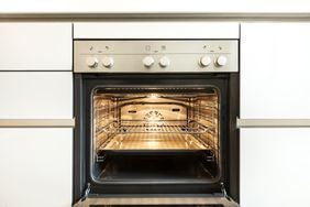 An oven with the door open.