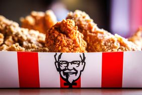 A box of fried chicken with the KFC logo on it