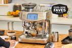 Espresso machine in use on a counter with coffee related tools 