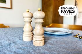 Wooden salt and pepper mills on a dining table badge indicating Food and Wine Faves