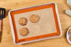 An overhead view of cookies baked on the Silpat Half-Size Nonstick Baking Mat
