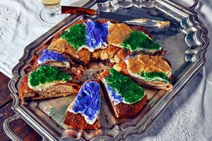 King Cake on a metal tray with a little plastic baby.