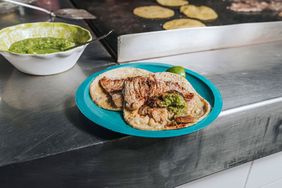 Tacos and a griddle at Taqueria El Califa de León.