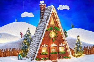A gingerbread house with skiers.