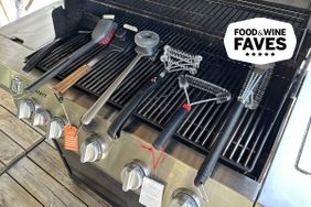 seven grill brushes on a Weber grill