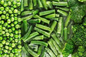 Frozen green peas green beans and broccoli florets displayed in sections