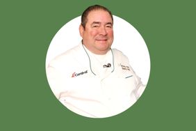 Emeril Lagasse in a chefs coat