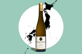 A wine bottle labeled Hermann J Wiemer placed in front of a map silhouette of Japan
