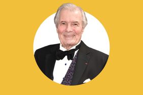 Jacques Ppin in a formal suit smiling