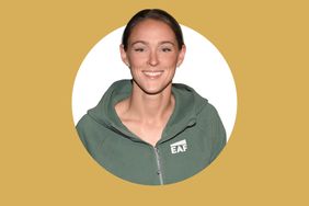 A person wearing a hoodie smiling in a portrait photo against a mustard yellow background