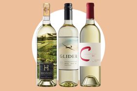 Three bottles of Sauvignon Blanc wine labeled Honig Glider and another with a red C on a beige background