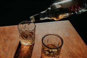 Whisky Pour from a bottle into a cut glass tumbler