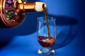 Beer being poured into a branded glass