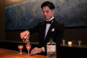 A bartender serving drinks at Bar Rondo.