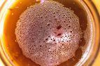 Overhead closeup of beer in a glass