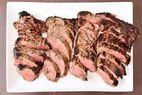 Slices of cooked Sirloin steaks arranged on a white plate