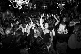 Crowded dance floor with women celebrating in a night club